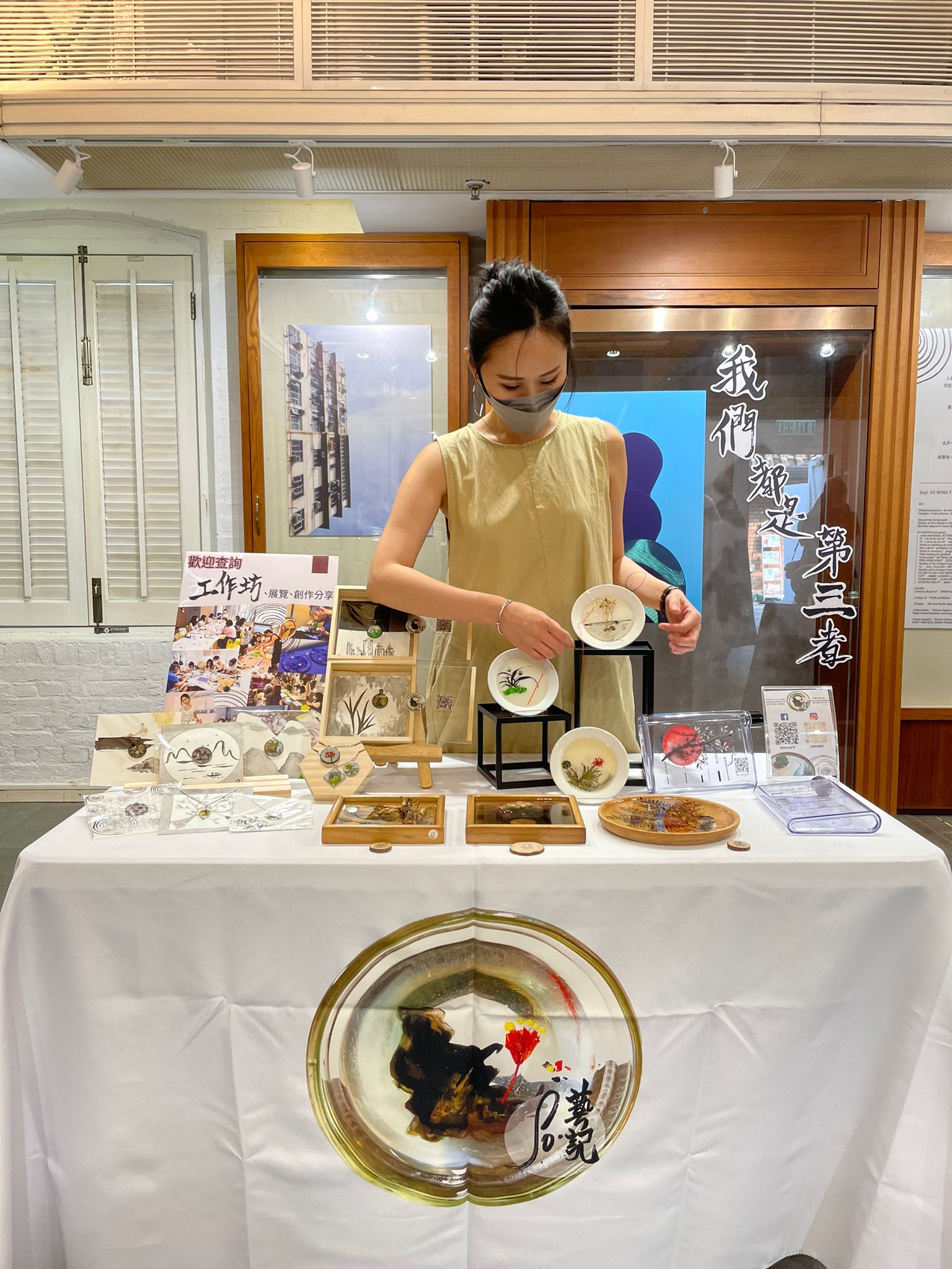 Photo of Soyi with her artworks.